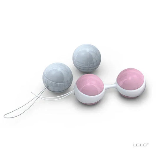 Les quatre boules LUNA Beads Mini roses et bleues, avec support blanc sur fond blanc